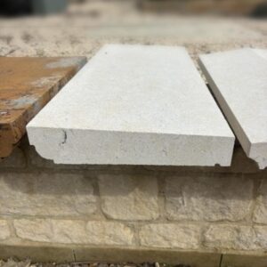 Once weathered Bathstone coping with cavetto detail, finished in a clean off-white tone